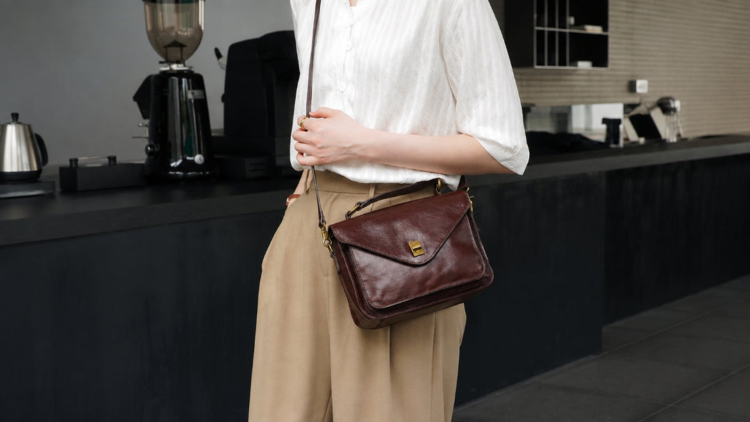 Woman wearing a leather crossbody bag across the front of her body for a casual everyday look