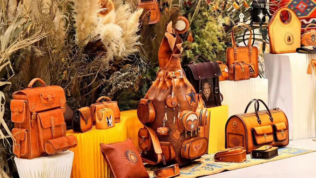 Collection of handcrafted ROCKBONE Italian vegetable tanned leather bags on artistic display.