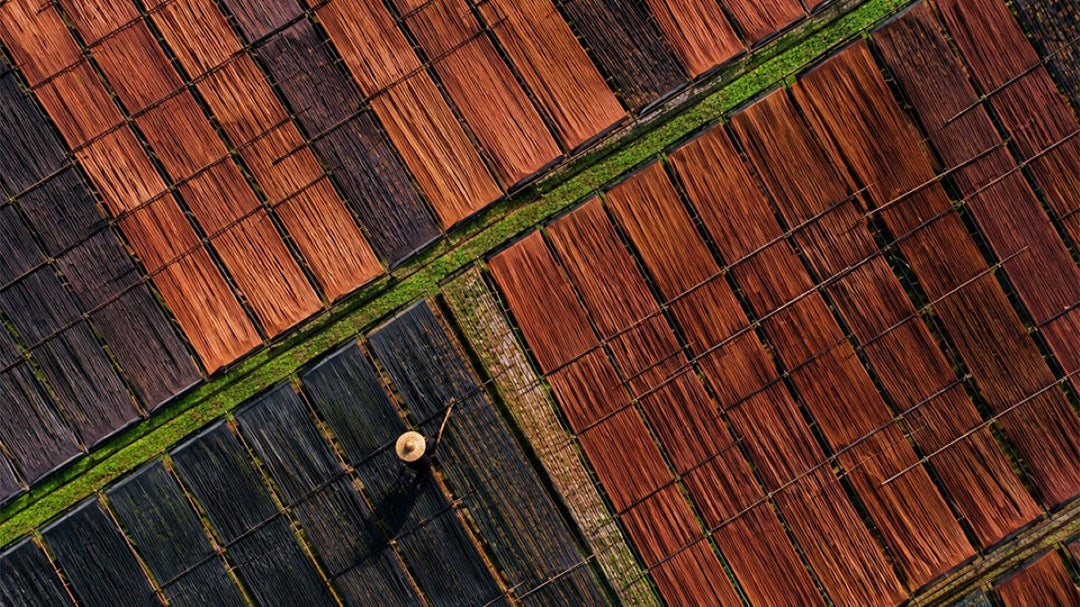 Traditional Xiangyunsha silk fabric drying in the sun during the natural dyeing process in China