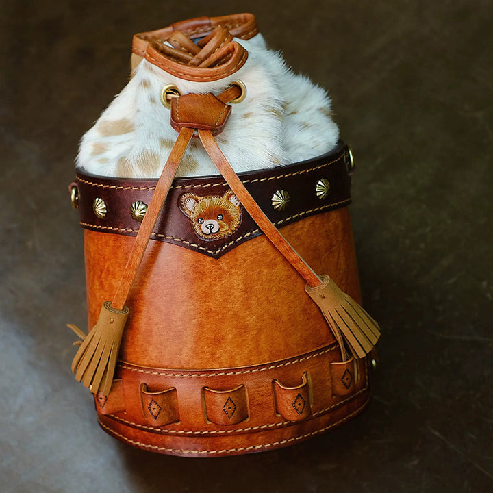 Hair-On Hide Leather Bucket Bag with Hand-Carved Bear Detail