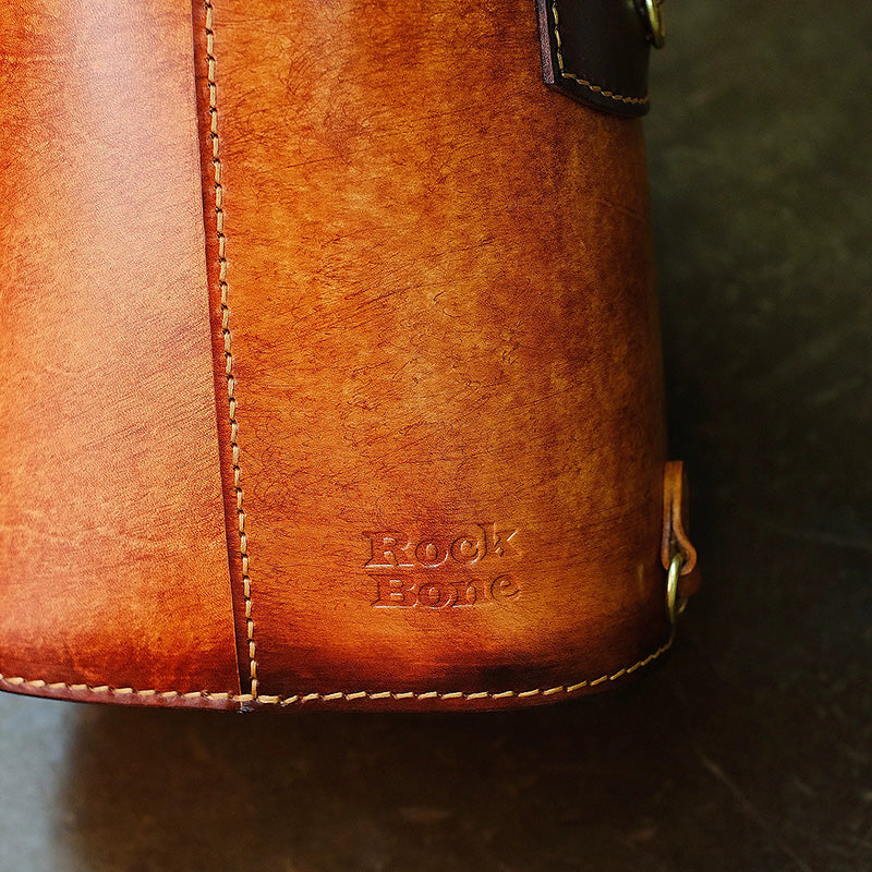 Hair-On Hide Leather Bucket Bag with Hand-Carved Bear Detail