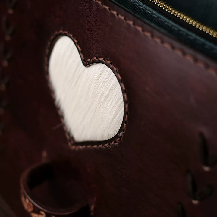 Hand-Tooled Leather Crossbody Bag with Heart Motifs