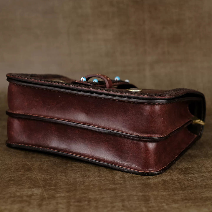 Hand-Tooled Leather Crossbody Bag with Heart Motifs