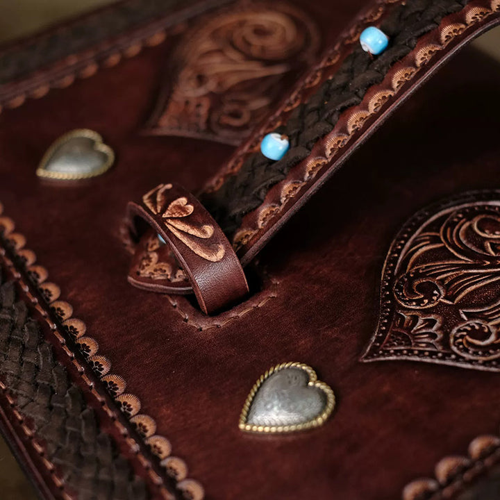 Hand-Tooled Leather Crossbody Bag with Heart Motifs