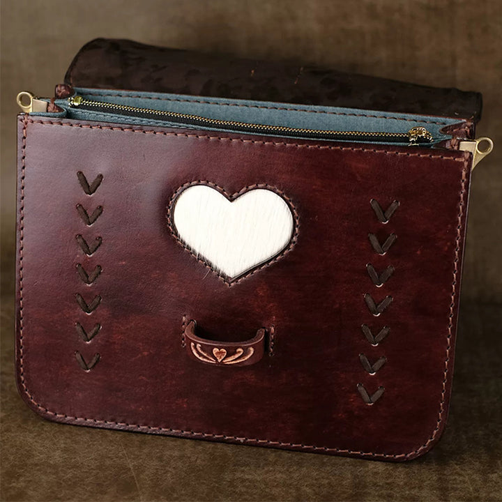 Hand-Tooled Leather Crossbody Bag with Heart Motifs