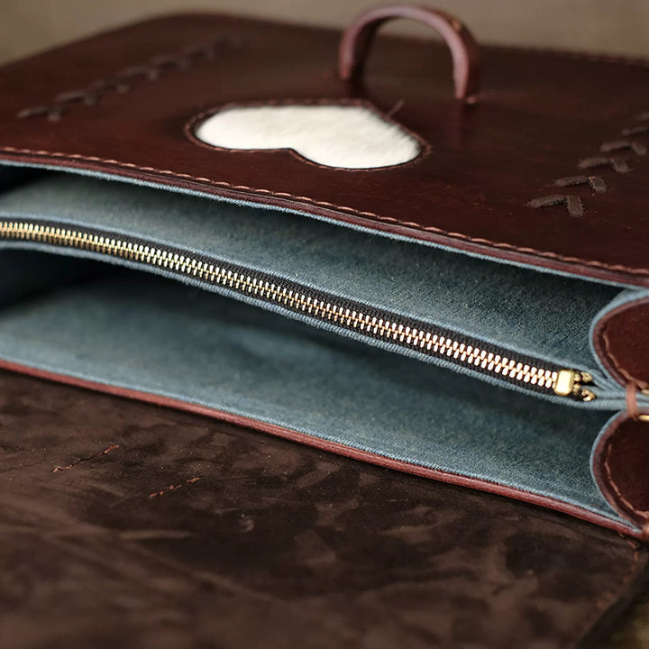 Hand-Tooled Leather Crossbody Bag with Heart Motifs