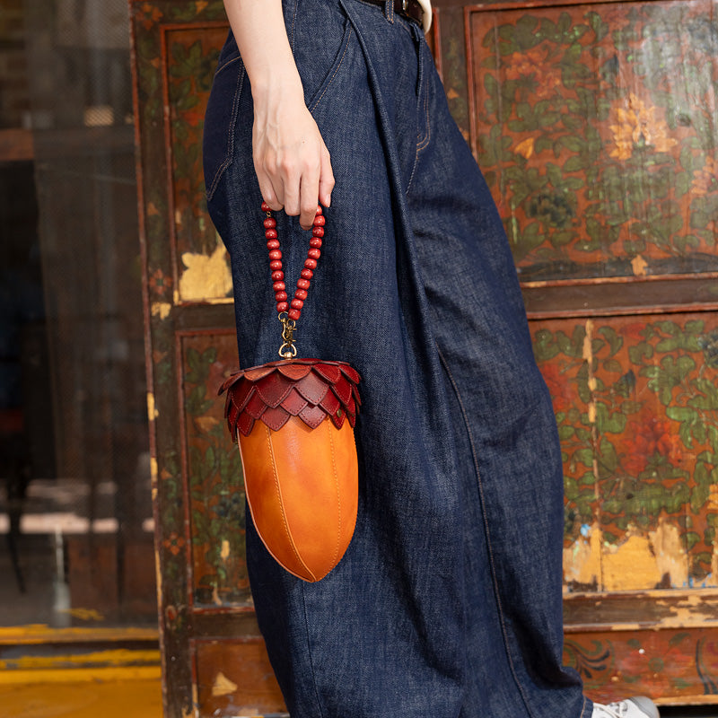 Handcrafted acorn leather novelty bag with burgundy pinecone scale cap and wooden bead handle