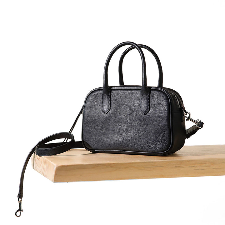 Black full grain leather Boston bag with top handle and detachable crossbody strap