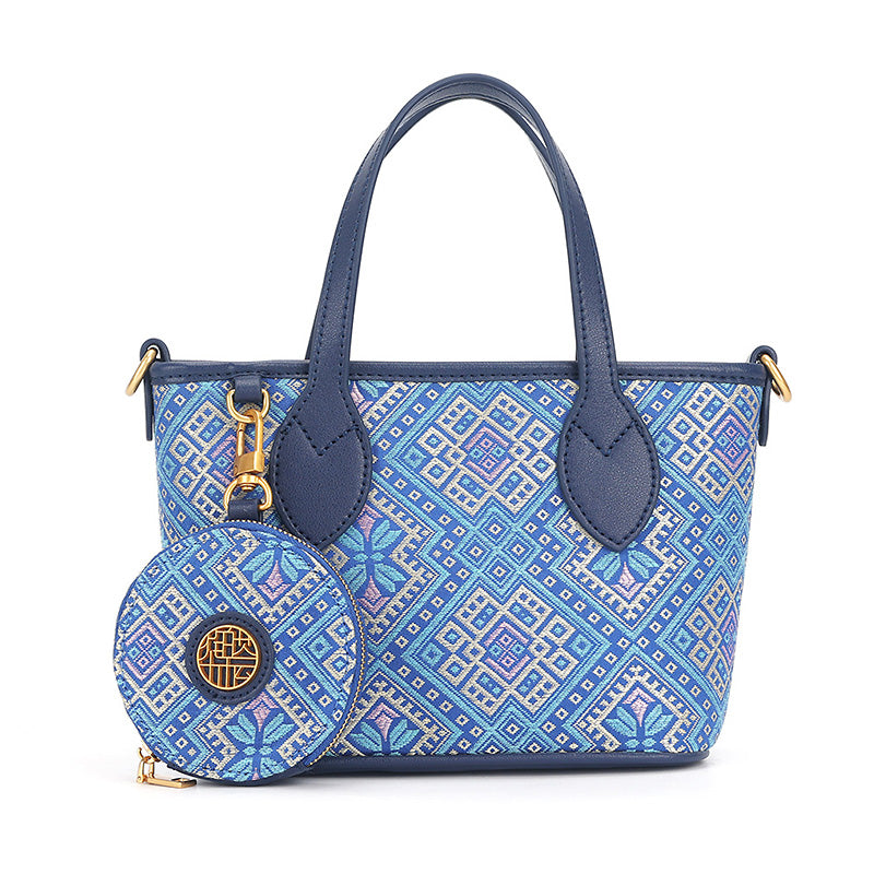 Blue leather mini tote bag with Zhuang Brocade gold and blue butterfly motif and matching coin pouch
