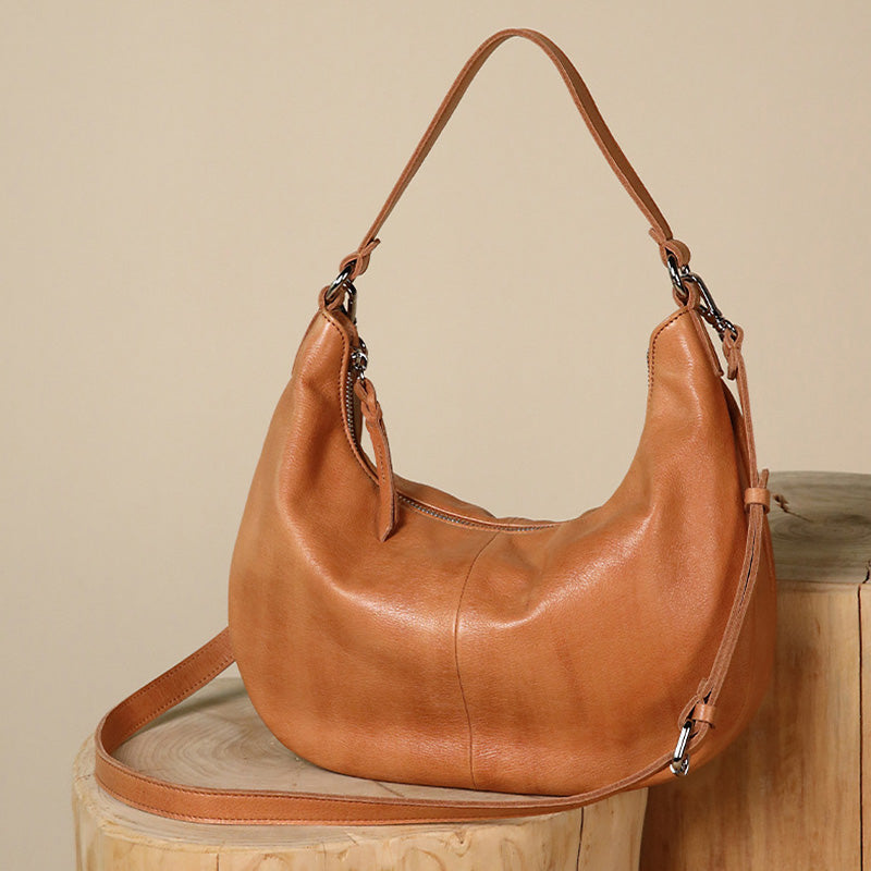 Brown water-dyed calfskin leather hobo bag with detachable strap, shown from the front
