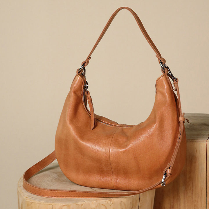 Brown water-dyed calfskin leather hobo bag with detachable strap, shown from the front