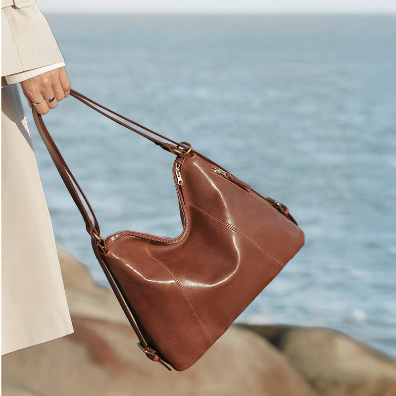 Brown vegetable tanned leather backpack purse with gold hardware, convertible to shoulder bag
