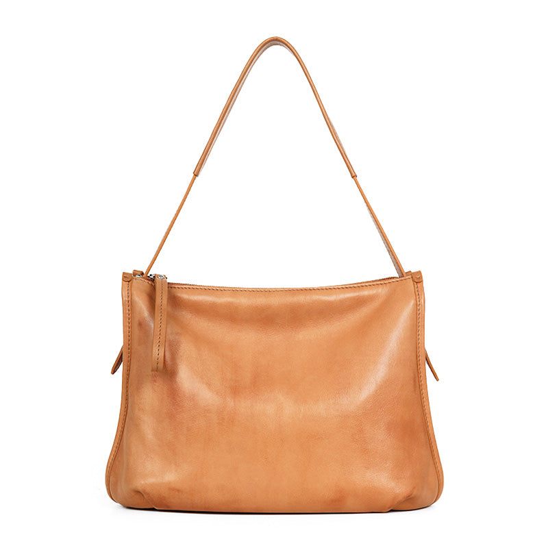 Camel full grain leather crossbody bag with adjustable shoulder strap, compact everyday style