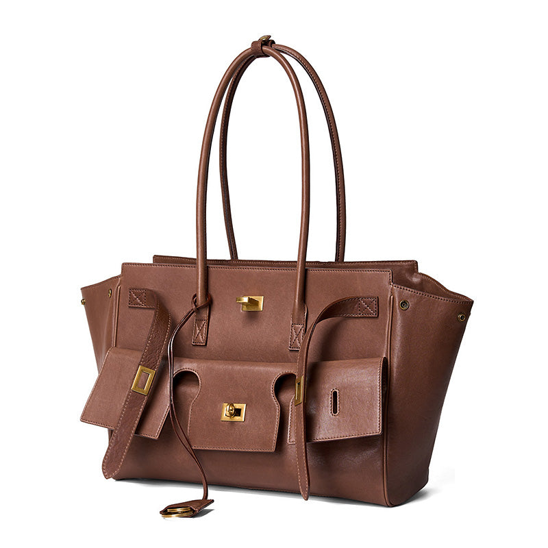 Coffee top grain leather laptop tote bag with brass twist-lock closure and structured silhouette