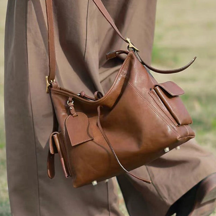 Coffee top grain leather hobo tote bag with slouchy silhouette and back zipper pocket