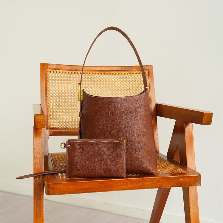 Slouchy cowhide leather bucket bag in brown — large everyday shoulder tote for women