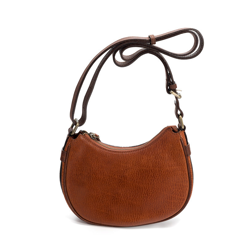 Brown washed full grain leather crescent bag with adjustable strap, front view