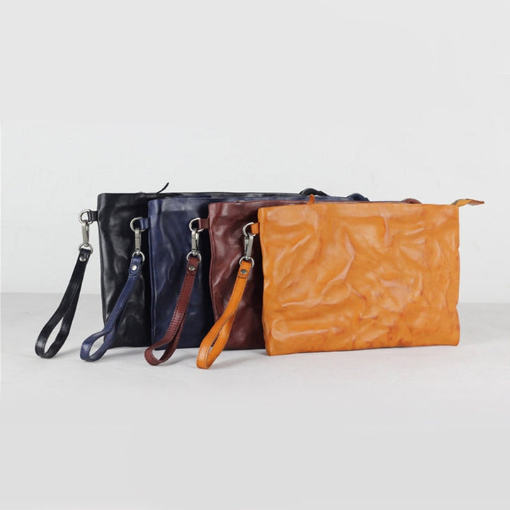 Crinkled leather wristlet clutch bag in four colors: yellow, brown, navy and black
