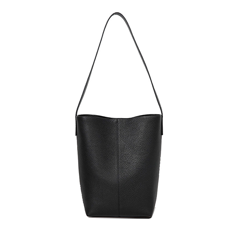 Black full grain cowhide leather bucket tote bag with slouchy silhouette, handheld and shoulder carry