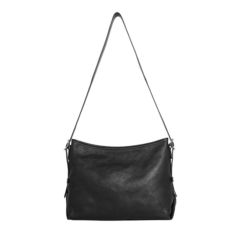 Black full grain leather hobo bag with slouchy silhouette and adjustable shoulder strap