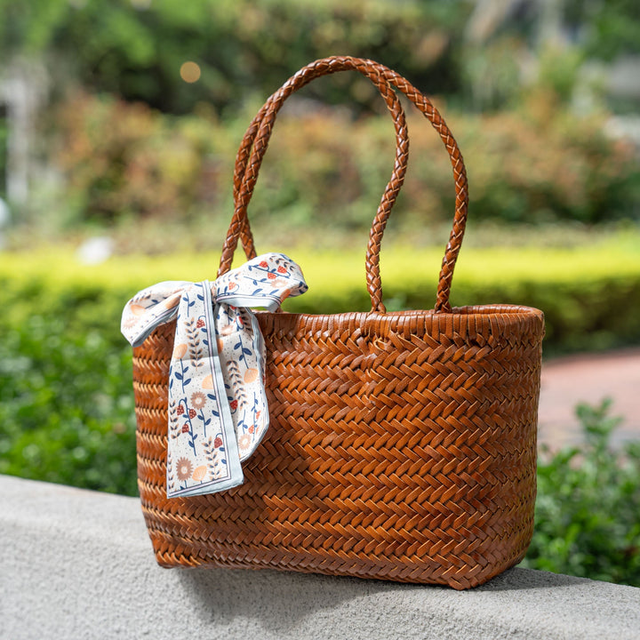 Handwoven leather tote bag in yellow, artisan braided cowhide basket bag for women