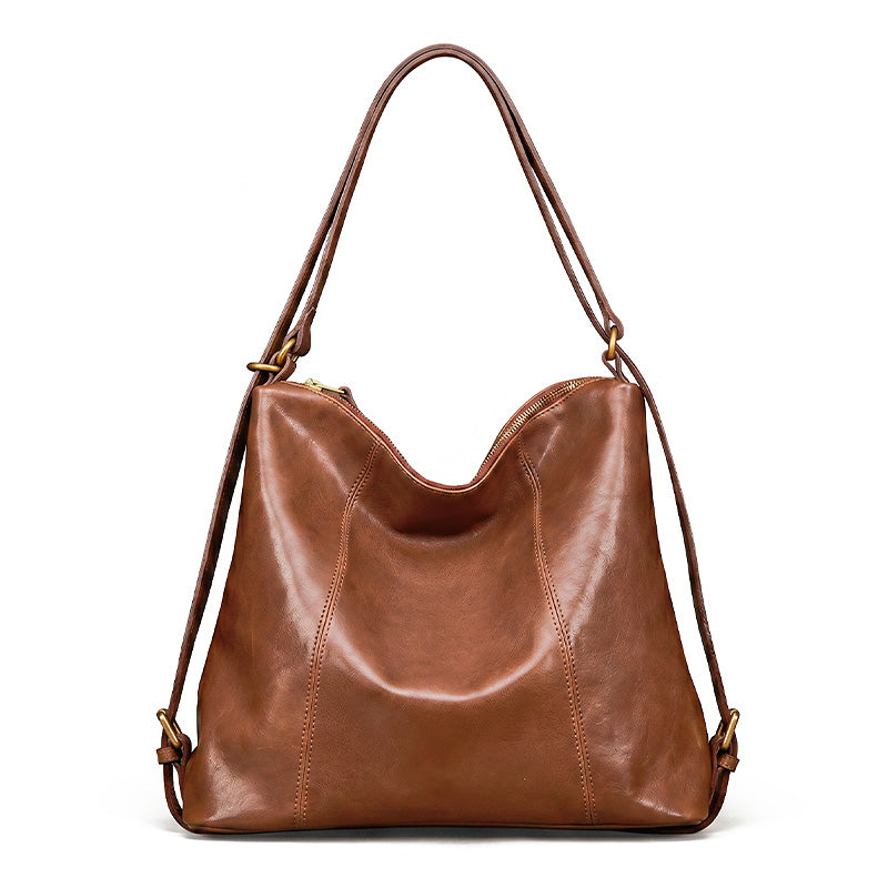 Brown vegetable tanned leather backpack purse with gold hardware, convertible to shoulder bag