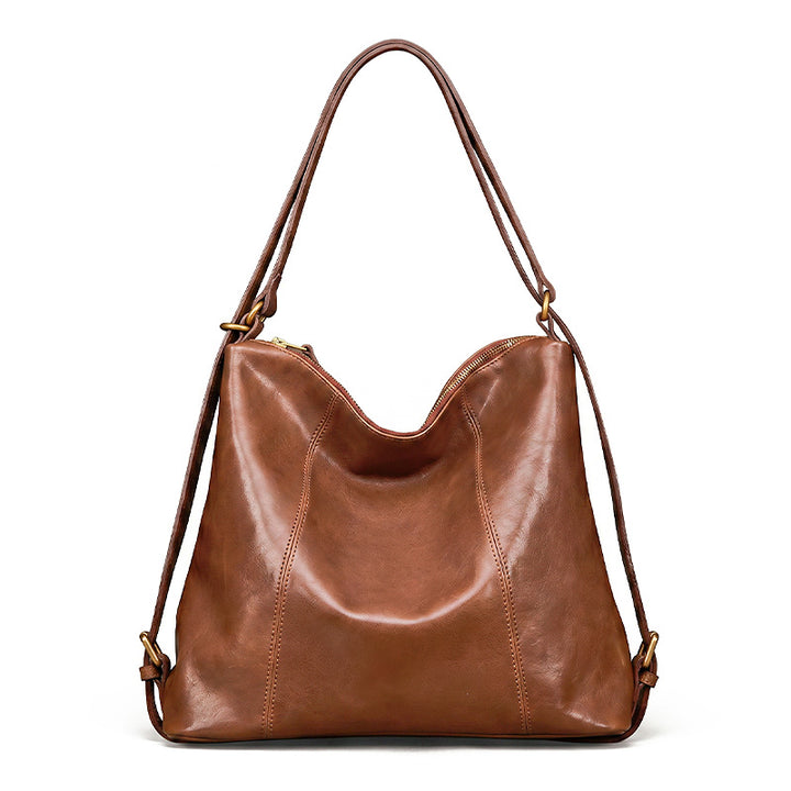 Brown vegetable tanned leather backpack purse with gold hardware, convertible to shoulder bag
