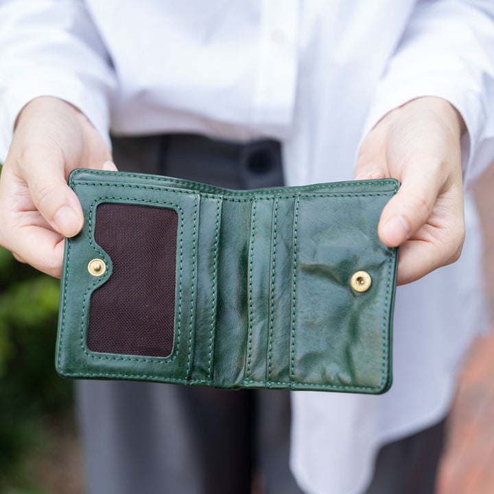 Slim handmade vegetable tanned leather bifold wallet in dark green