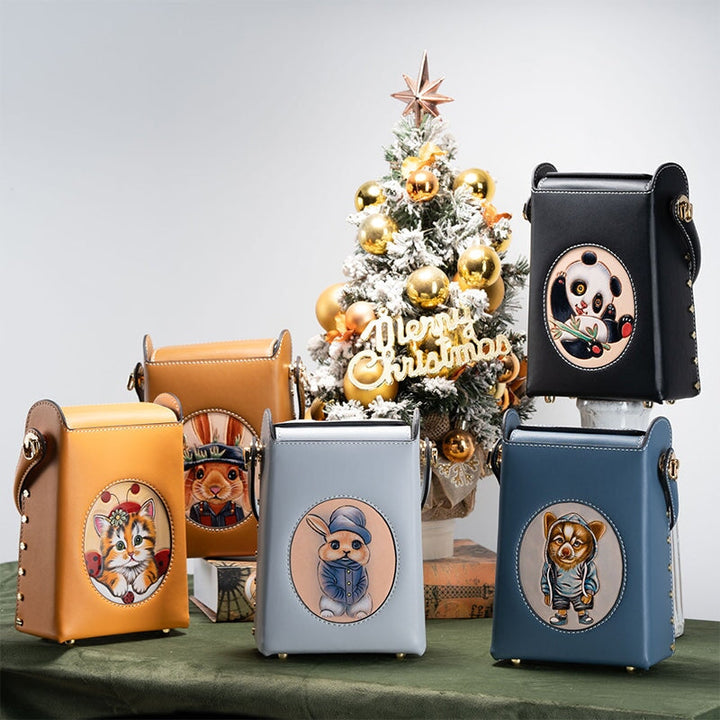 Hand tooled leather box bag collection with carved animal designs in 5 colors