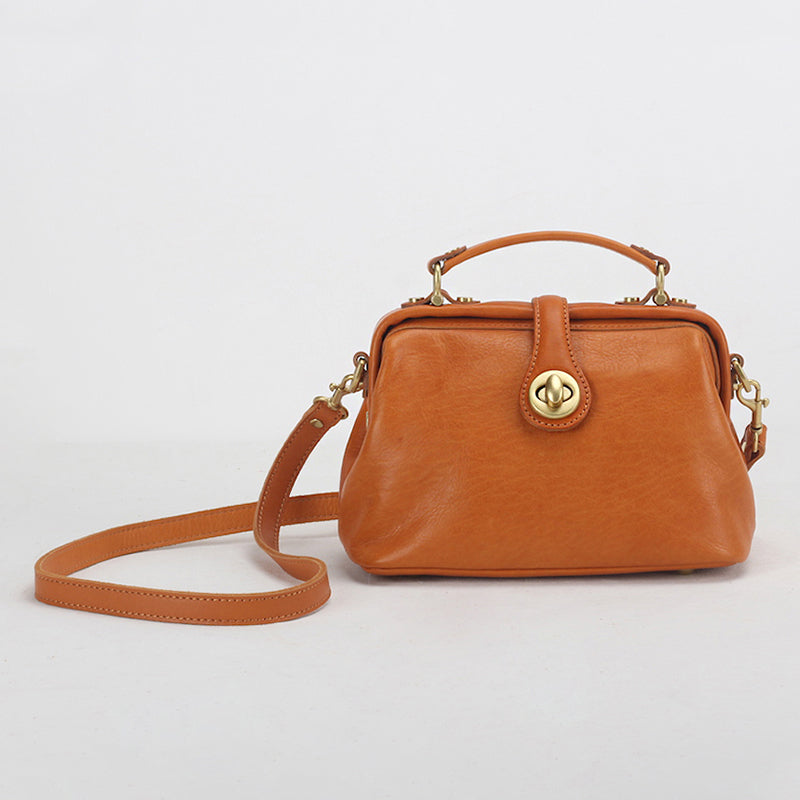 Sunset yellow handmade leather doctor bag with brass twist lock and crossbody strap