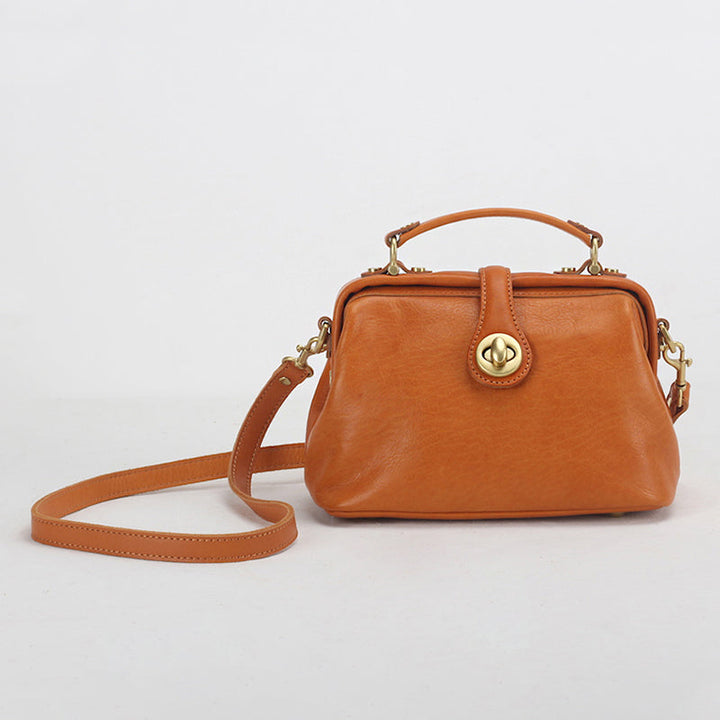 Sunset yellow handmade leather doctor bag with brass twist lock and crossbody strap