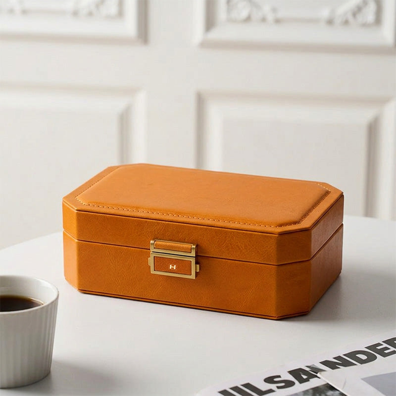 Vegetable tanned leather jewelry box with mirror and brass lock clasp, trunk style travel organizer for rings and necklaces.