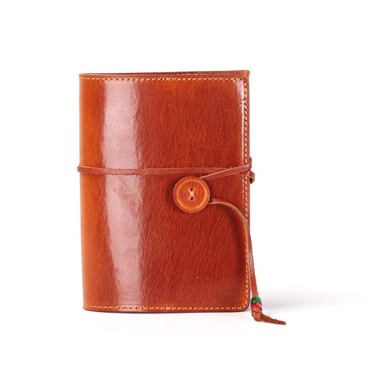 Vegetable tanned leather journal with wooden button tie closure in sunset yellow