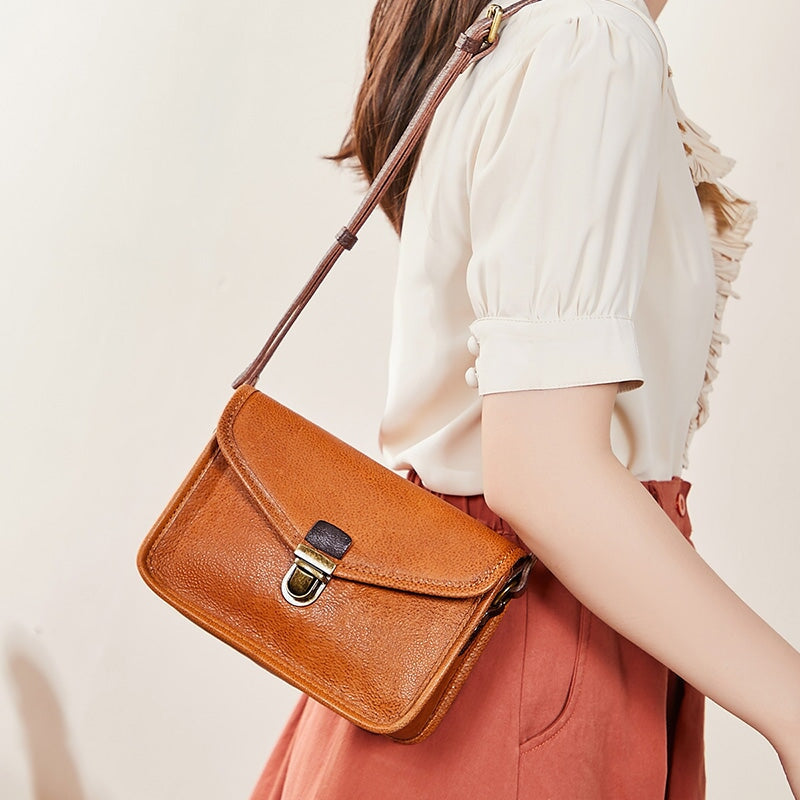 Women's retro leather messenger bag in cognac brown