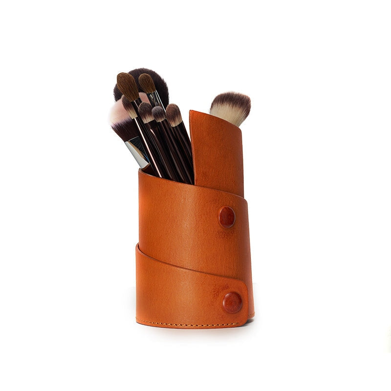 Vegetable tanned leather pen holder for desk in sunset yellow, filled with makeup brushes