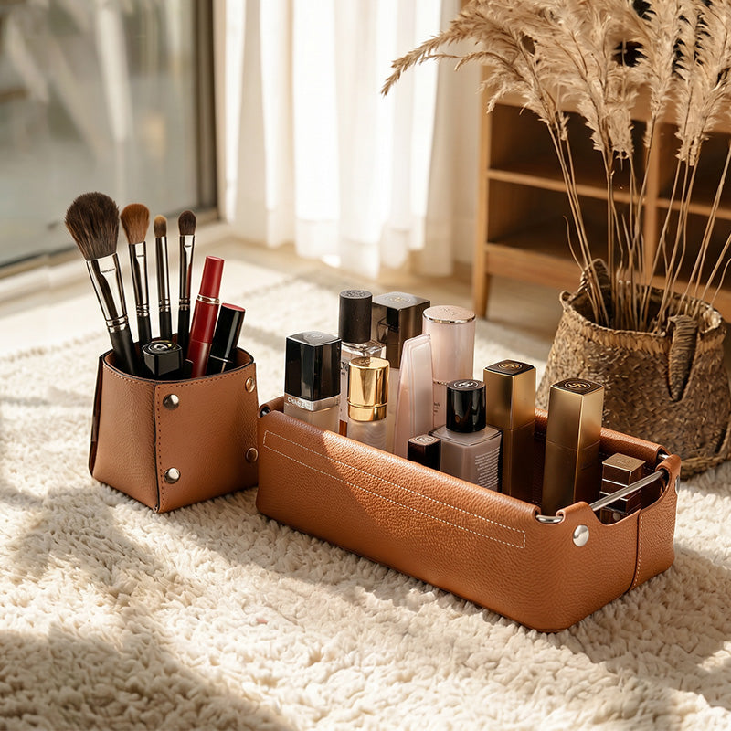 Brown leather valet tray and pen cup organizer set on a soft rug