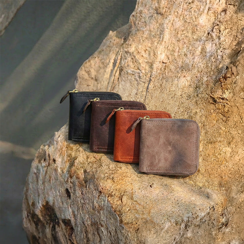 Vegetable tanned leather zip around wallet with gold zipper and snap-close coin pocket.