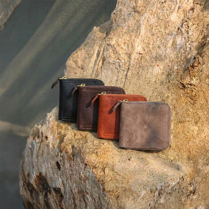 Vegetable tanned leather zip around wallet with gold zipper and snap-close coin pocket.
