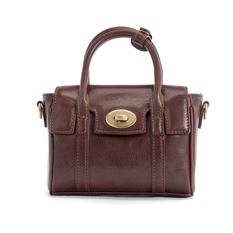 Brown full grain leather mini satchel bag with gold twist lock and knot top handle, front view