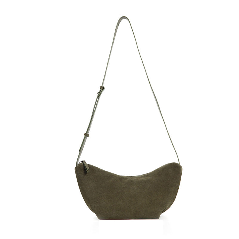 Nubuck leather dumpling bag in dark green with a matte vintage finish and adjustable crossbody strap
