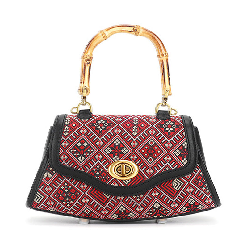 Red leather handbag with Zhuang Brocade pattern and bamboo handle