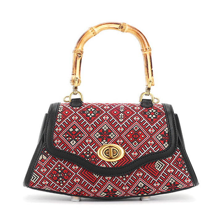 Red leather handbag with Zhuang Brocade pattern and bamboo handle