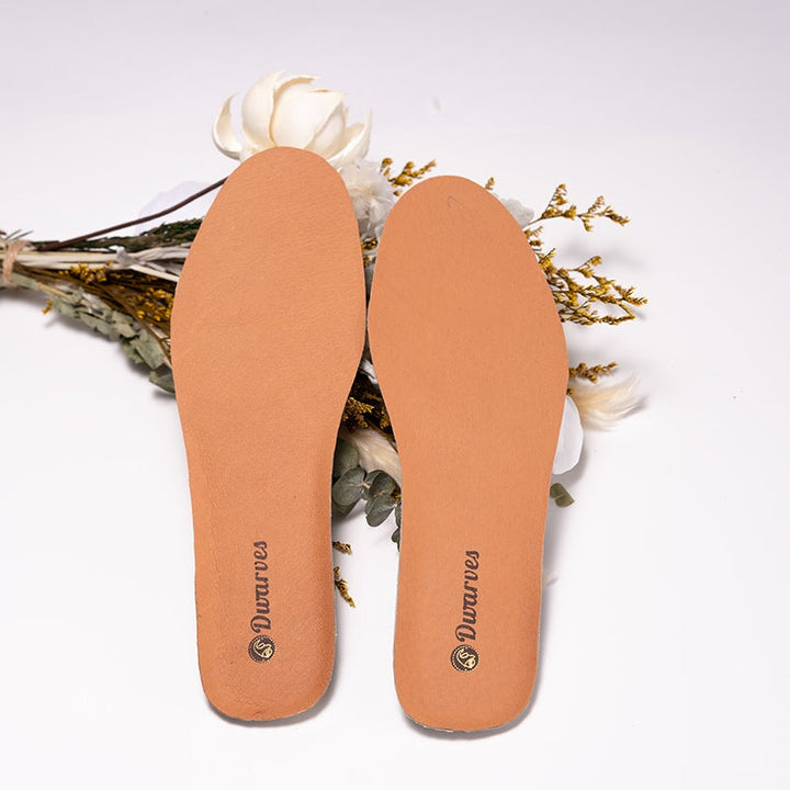 A pair of genuine sheepskin leather insoles in nude, soft cushion shoe inserts by Dwarves