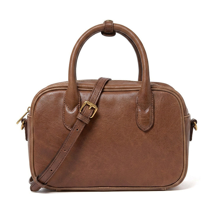 Small vegetable tanned leather Boston bag in brown with gold hardware, top handle and detachable crossbody strap