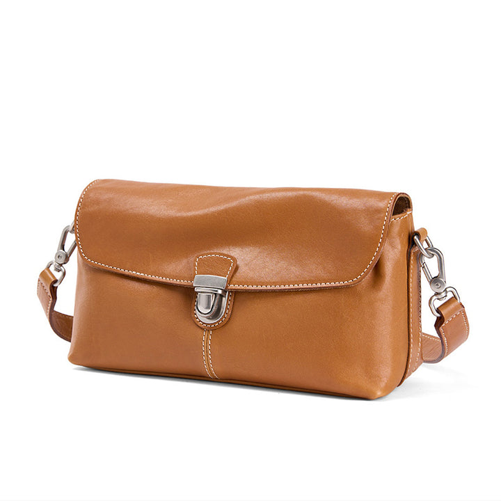 Small vegetable tanned cowhide leather crossbody bag in camel with gold-plated snap closure and detachable strap