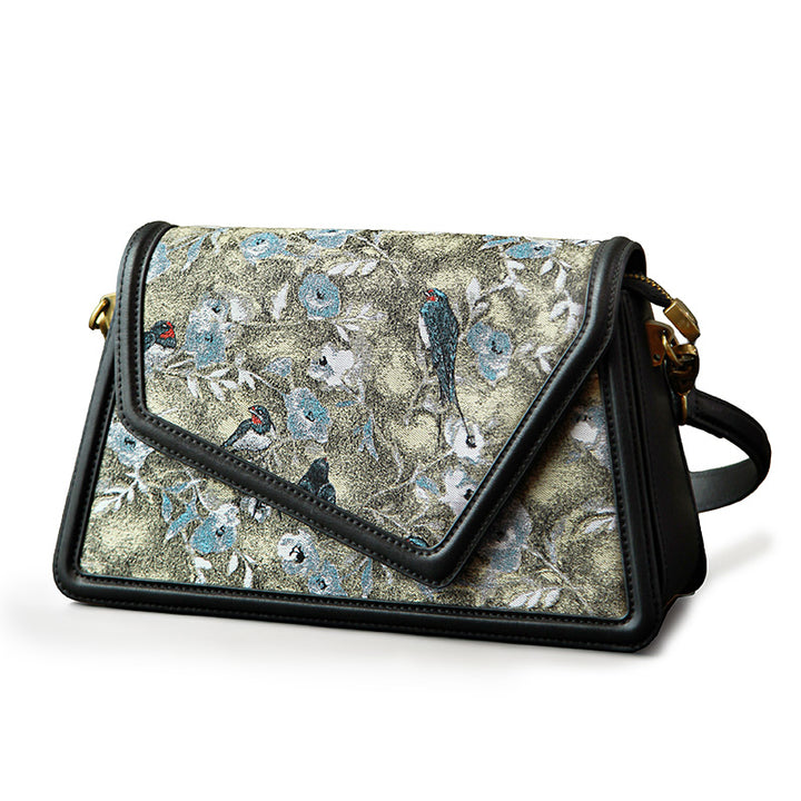Gray Song Brocade envelope crossbody bag with floral bird pattern and gold hardware