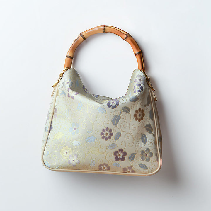 Cream Song Brocade silk top handle bag with bamboo handle and multicolor floral jacquard
