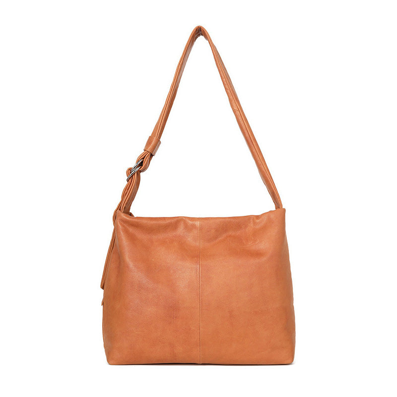 Top grain leather hobo bag in orange with a slouchy silhouette and adjustable shoulder strap