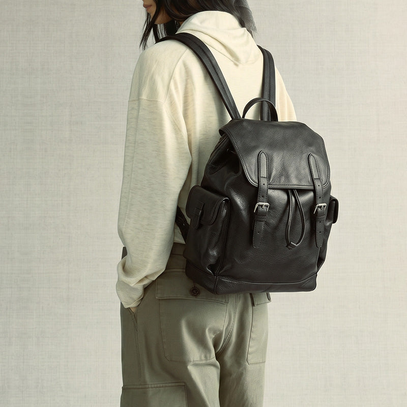 Large vegetable tanned leather drawstring backpack with flap closure and buckle side pockets