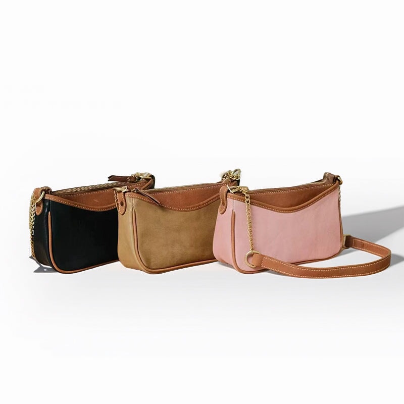 Handcrafted vegetable tanned leather baguette bag with two-tone underarm silhouette